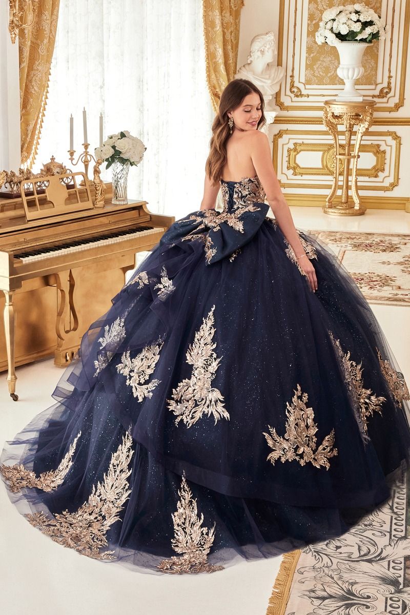 STRAPLESS LAYERED BALL GOWN WITH BOW DETAIL